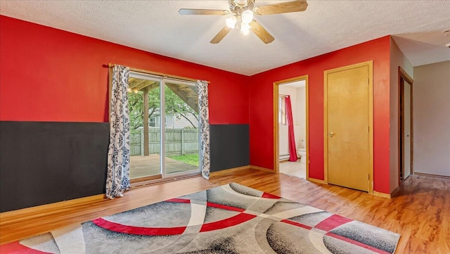 838 Cayuga Way, Stroudsburg, PA 18360 - interior space with access to outside, wood finished floors, a textured ceiling, ensuite bathroom, and ceiling fan