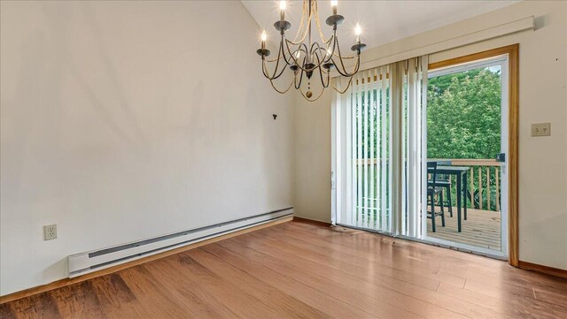 838 Cayuga Way, Stroudsburg, PA 18360 - spare room with baseboard heating, a chandelier, and wood finished floors