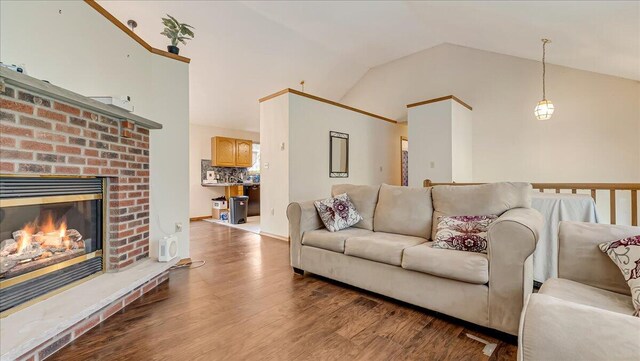 838 Cayuga Way, Stroudsburg, PA 18360 - living room with wood finished floors, lofted ceiling, and a brick fireplace