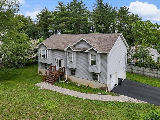 838 Cayuga Way, Stroudsburg, PA 18360 - raised ranch featuring driveway, an attached garage, roof with shingles, and view of scattered trees