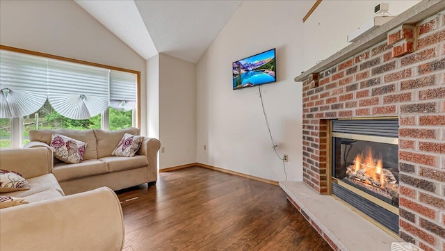 838 Cayuga Way, Stroudsburg, PA 18360 - living room with lofted ceiling, wood finished floors, healthy amount of natural light, and a brick fireplace
