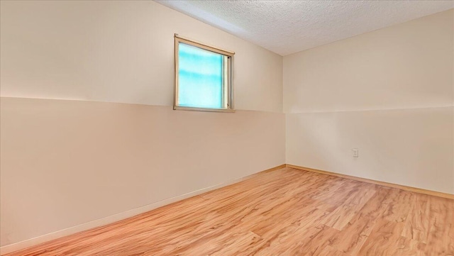 838 Cayuga Way, Stroudsburg, PA 18360 - empty room featuring wood finished floors and a textured ceiling