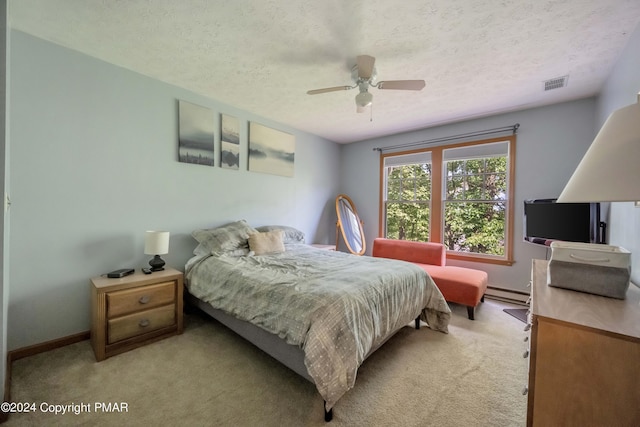 480 Spruce Dr, Tannersville, PA 18372 - bedroom featuring light carpet, a baseboard radiator, a textured ceiling, baseboards, and ceiling fan