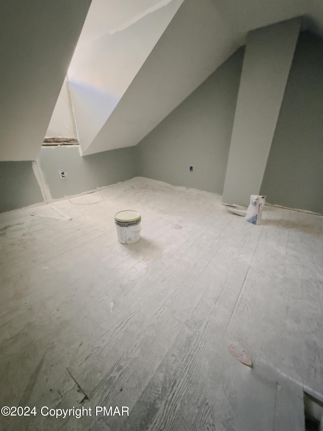 bonus room featuring vaulted ceiling