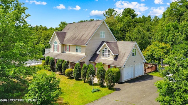 2247 Reo Dr, Effort, PA 18330 - view of front facade with driveway, a garage, and roof with shingles