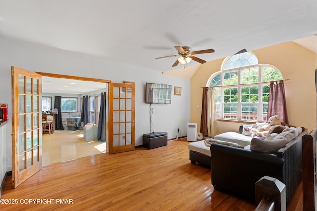 2247 Reo Dr, Effort, PA 18330 - living room featuring wood finished floors, a ceiling fan, french doors, and lofted ceiling