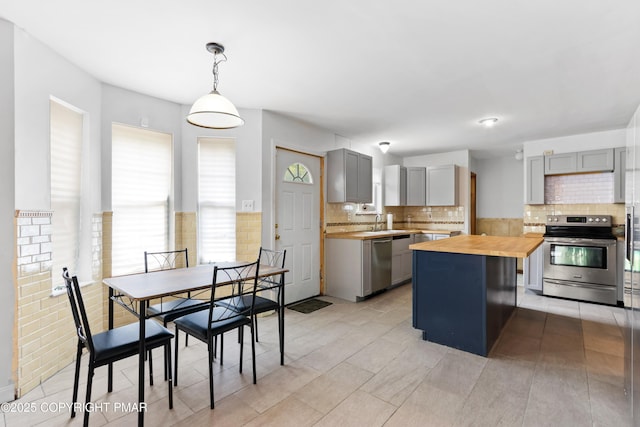 2247 Reo Dr, Effort, PA 18330 - kitchen featuring butcher block countertops, gray cabinetry, and stainless steel appliances