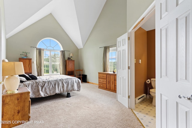 2247 Reo Dr, Effort, PA 18330 - bedroom with multiple windows, baseboard heating, vaulted ceiling, light colored carpet, and ensuite bathroom