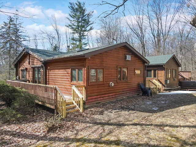 exterior space with crawl space, a shingled roof, a wooden deck, and entry steps