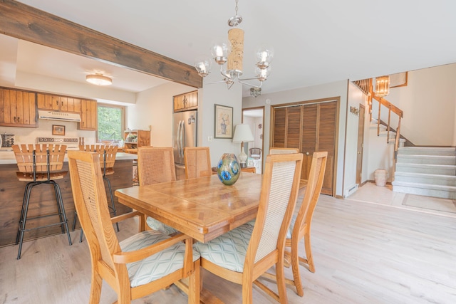 65 Maplewood Rd, Lake Harmony, PA 18624 - dining room featuring a chandelier, stairway, and light wood-type flooring