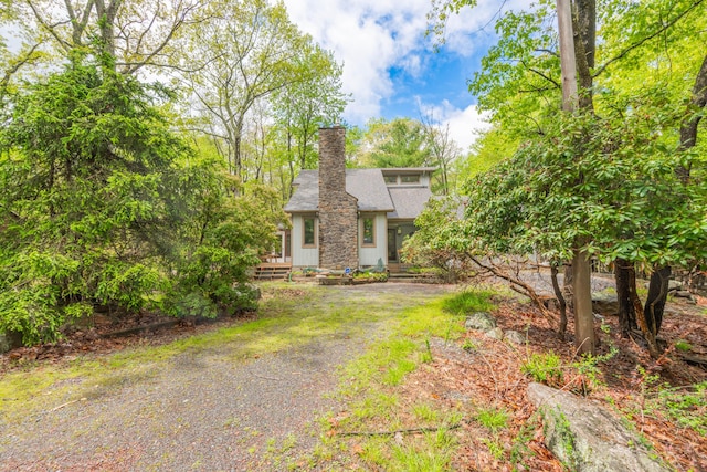 65 Maplewood Rd, Lake Harmony, PA 18624 - view of front of house with a chimney and roof with shingles