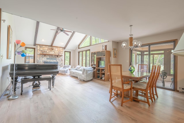 65 Maplewood Rd, Lake Harmony, PA 18624 - dining area featuring light wood finished floors, a chandelier, a fireplace, and a ceiling fan