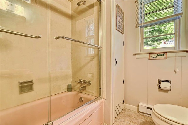 bathroom featuring tile patterned flooring, toilet, combined bath / shower with glass door, a baseboard radiator, and baseboards