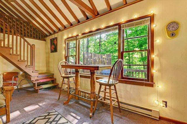 interior space featuring carpet floors, stairway, and lofted ceiling with beams
