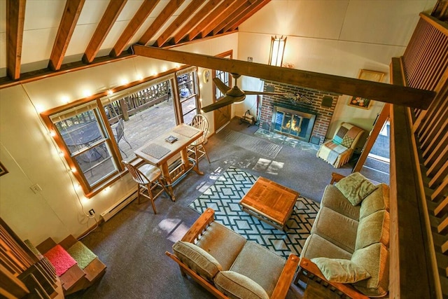 living room featuring lofted ceiling with beams and a fireplace