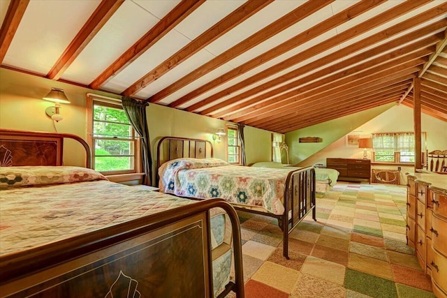 bedroom with vaulted ceiling with beams