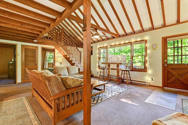 living room with carpet floors, high vaulted ceiling, baseboards, and stairs