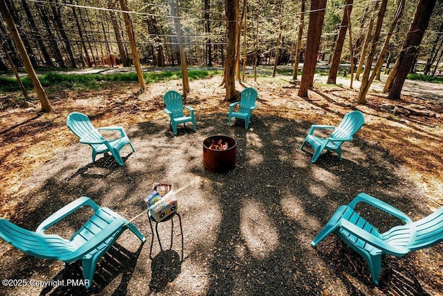 view of yard with an outdoor fire pit