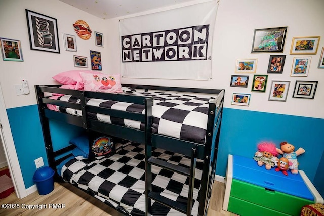 bedroom featuring wood finished floors