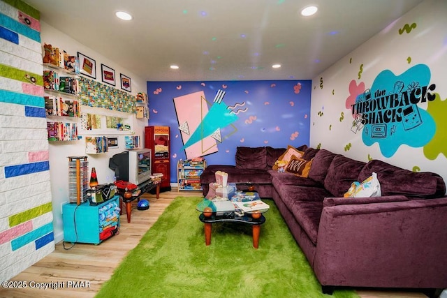 living room with recessed lighting and wood finished floors