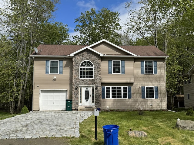 7075 Boulder Ct, Tobyhanna, PA 18466 - traditional home with a garage, decorative driveway, a front lawn, and stone siding