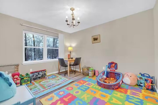 7075 Boulder Ct, Tobyhanna, PA 18466 - playroom with a chandelier and baseboards
