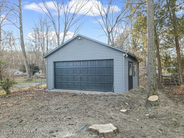 detached garage with fence