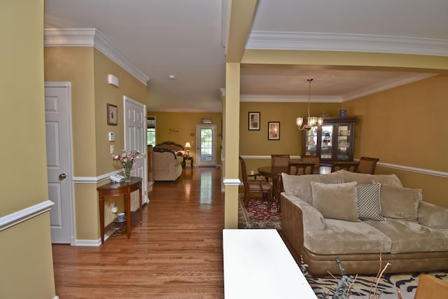 1785 Big Ridge Dr, East Stroudsburg, PA 18302 - living room with light wood-style floors, a chandelier, and crown molding