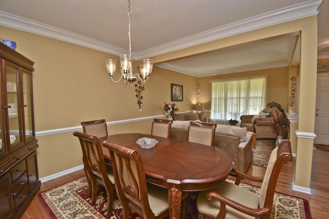 1785 Big Ridge Dr, East Stroudsburg, PA 18302 - dining room featuring crown molding, wood finished floors, and a chandelier