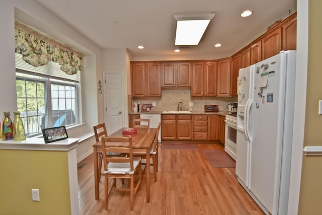 1785 Big Ridge Dr, East Stroudsburg, PA 18302 - kitchen featuring white appliances, light wood finished floors, decorative backsplash, recessed lighting, and brown cabinets
