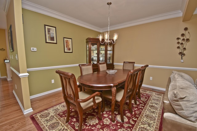 1785 Big Ridge Dr, East Stroudsburg, PA 18302 - dining area featuring a chandelier, crown molding, and light wood-style flooring