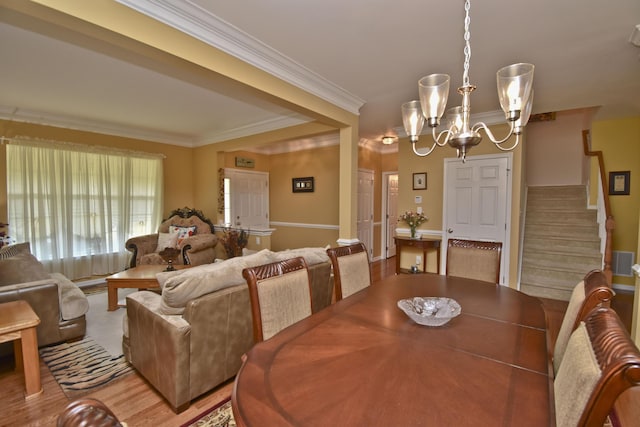 1785 Big Ridge Dr, East Stroudsburg, PA 18302 - dining space with stairway, a chandelier, ornamental molding, and light wood finished floors