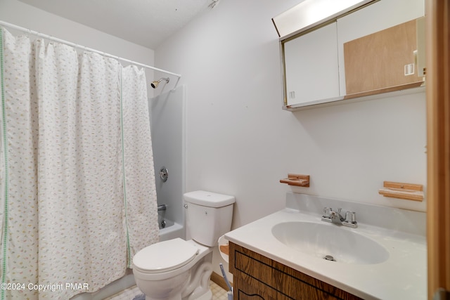 bathroom featuring toilet, shower / bath combo, and vanity