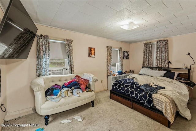 carpeted bedroom featuring cooling unit and baseboards