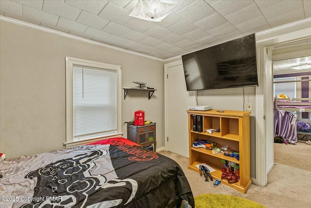 bedroom with carpet floors and ornamental molding