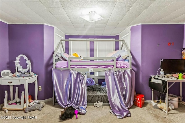 bedroom with carpet floors and baseboards