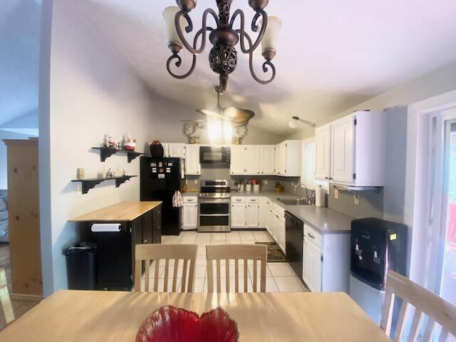 1293 Winding Way, Tobyhanna, PA 18466 - kitchen featuring black appliances, vaulted ceiling, light tile patterned flooring, a chandelier, and white cabinets