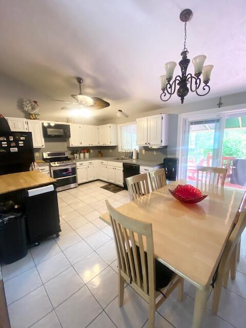 1293 Winding Way, Tobyhanna, PA 18466 - dining area featuring light tile patterned floors, a chandelier, and ceiling fan