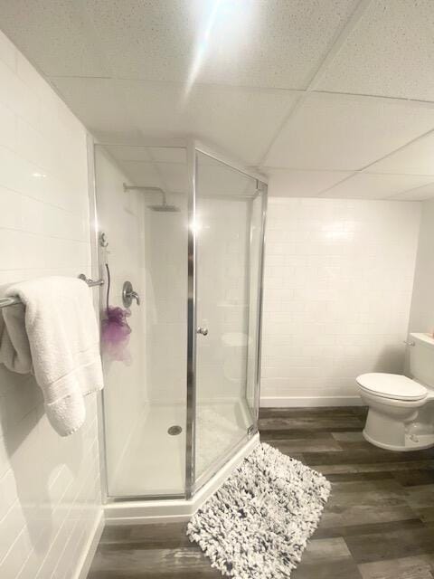 1293 Winding Way, Tobyhanna, PA 18466 - full bath featuring a shower stall, wood finished floors, and concrete block wall
