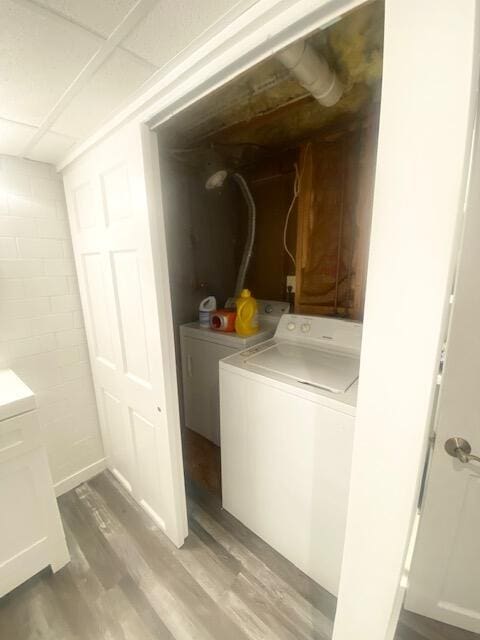 1293 Winding Way, Tobyhanna, PA 18466 - laundry room with independent washer and dryer, concrete block wall, and light wood-style flooring