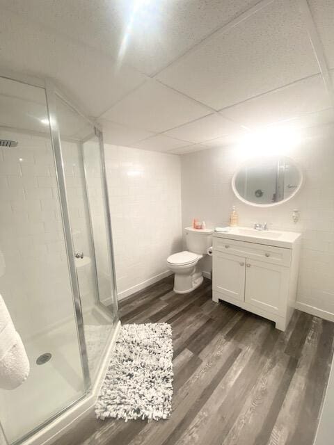 1293 Winding Way, Tobyhanna, PA 18466 - bathroom featuring a shower stall, wood finished floors, vanity, and a drop ceiling