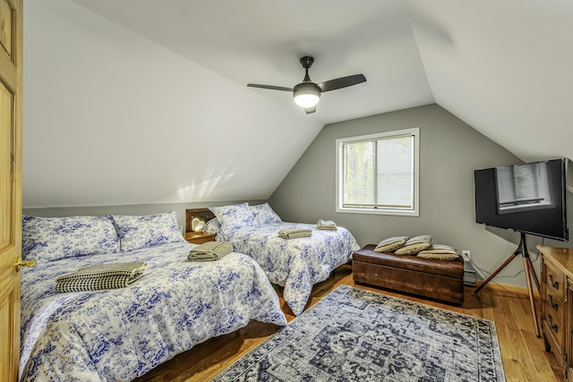 268 Outer Dr, Pocono Lake, PA 18347 - bedroom featuring vaulted ceiling, a ceiling fan, and wood finished floors