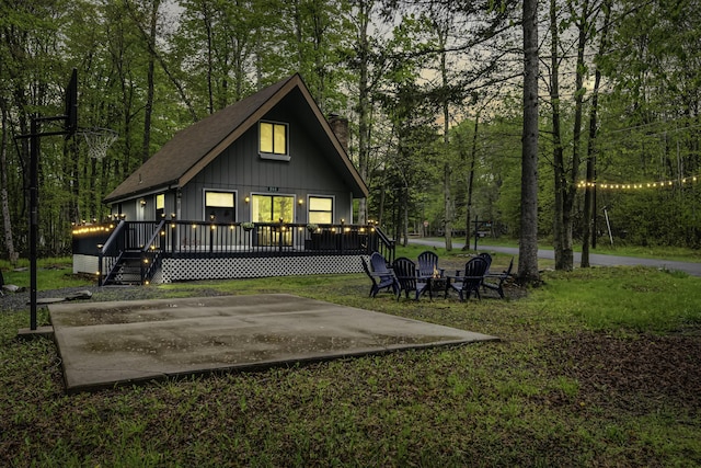 268 Outer Dr, Pocono Lake, PA 18347 - back of property featuring a chimney, a yard, a deck, and an outdoor fire pit