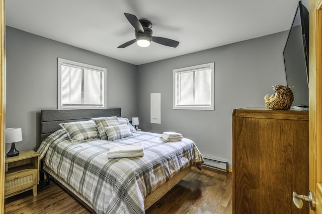 268 Outer Dr, Pocono Lake, PA 18347 - bedroom with a baseboard heating unit, dark wood-type flooring, and a ceiling fan