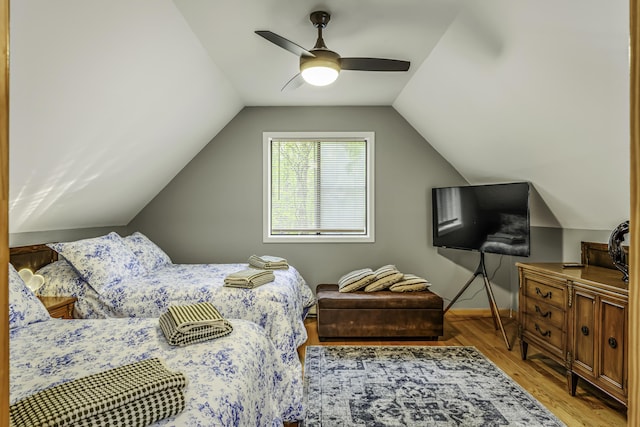 268 Outer Dr, Pocono Lake, PA 18347 - bedroom with wood finished floors, lofted ceiling, a ceiling fan, and baseboards