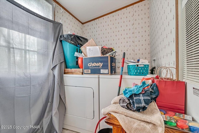 clothes washing area with wallpapered walls, washing machine and dryer, and ornamental molding