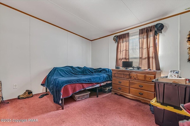 bedroom with lofted ceiling, crown molding, and carpet flooring