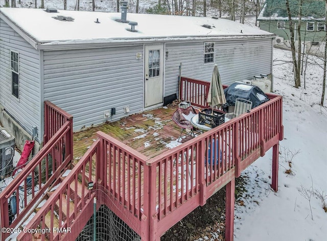 snow covered deck featuring grilling area