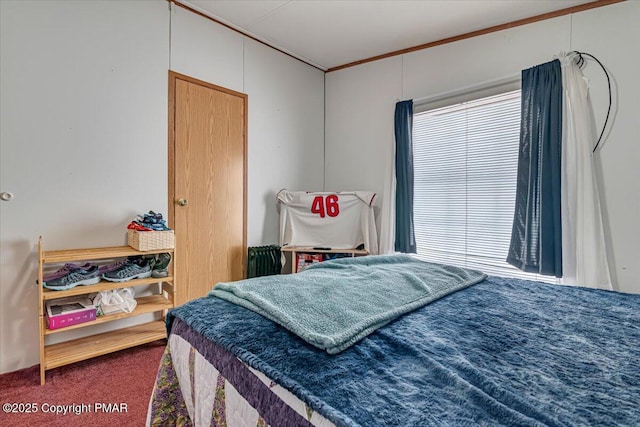 carpeted bedroom with crown molding