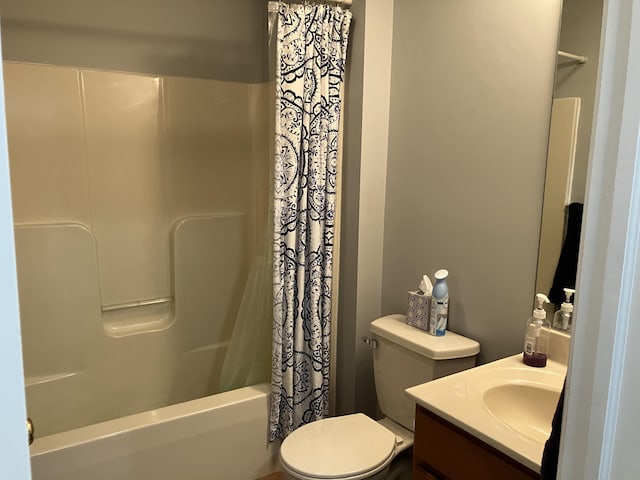bathroom featuring shower / bath combo, vanity, and toilet